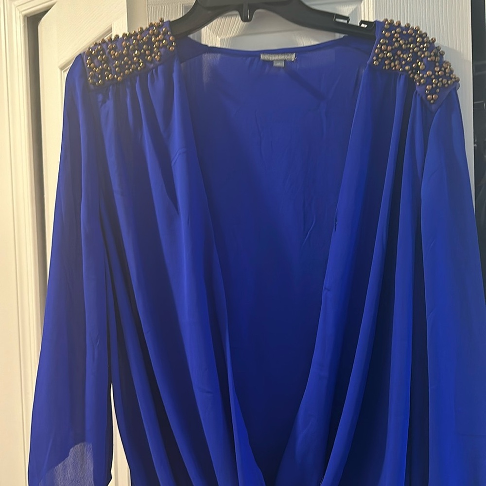 Royal blue top with gold embellishments on shoulders